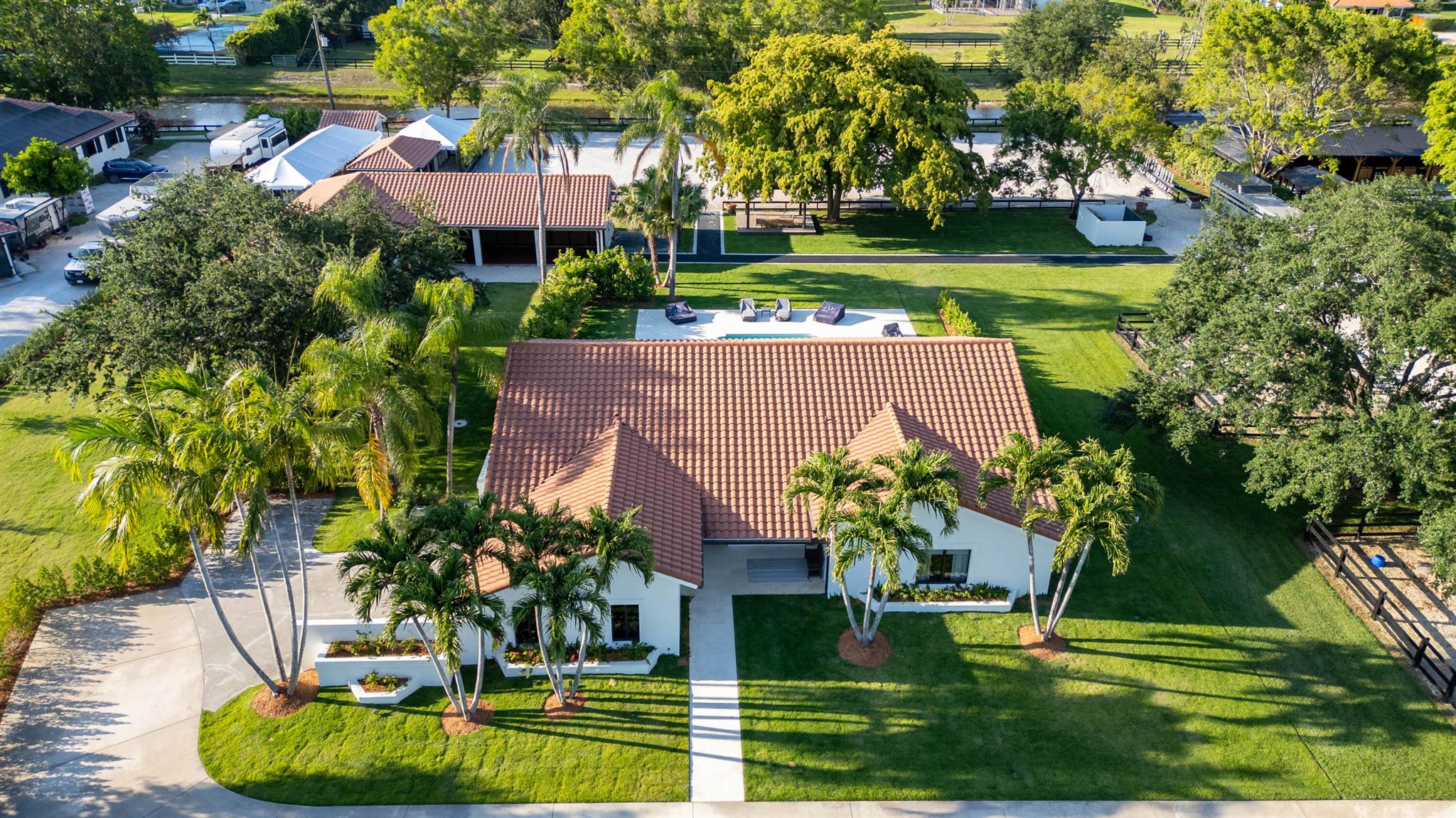 Renovated equestrian farm available for the 2026 seasonExperience elevated equestrian living at this beautifully fully renovated property in early 2025 with designer finishes and bespoke furnishings throughout. This private, 4-bedroom, 3-bathroom residence offers a serene escape, complete with a heated pool--ideal for unwinding after a day at the show-grounds.Equestrian amenities are thoughtfully designed and meticulously maintained. The main barn features 7 spacious stalls, while a secondary barn offers 2 additional stalls. Additional highlights include high-powered fans, an air-conditioned tack room, a professional fly spray system, and two covered wash racks. On-site staff accommodations include a separate 2-bedroom residence, ensuring comfort and convenience for your team.