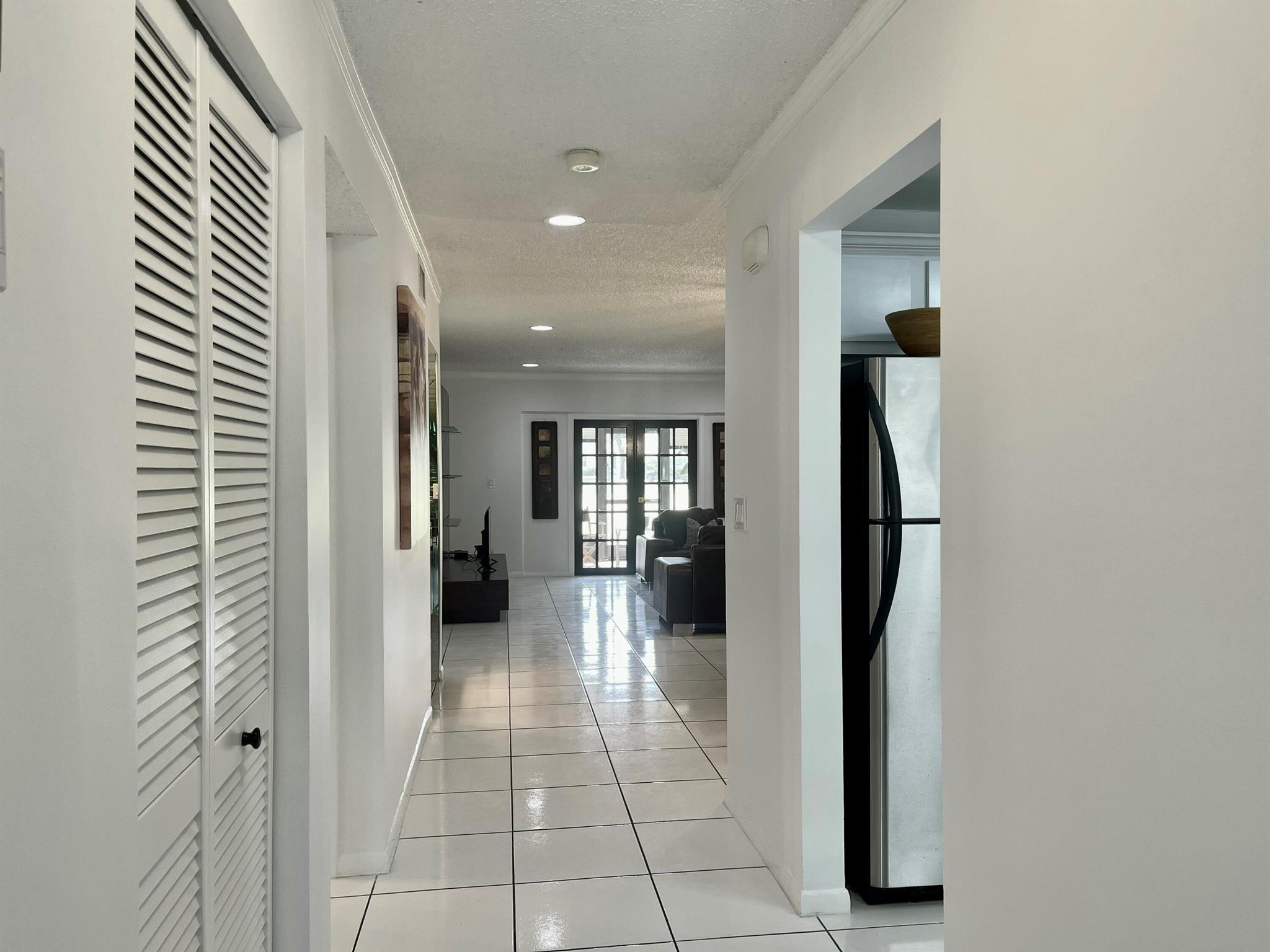 First floor on golf coarse. Nestled on a quiet street and steps from your private parking space. Freshly painted, new large hot water heater, updated plumbing, A/C system recently replaced, updated electrical features with GFI, new bathroom vanities, master bathroom with double sinks, bathroom vanities with Quartz Counter Tops. Master bedroom features new luxury Vinyl flooring. New lighting which are all on dimmers. Granite in kitchen. Patio screening and door is new. Patio is protected with roll down hurricane shutters. Great location in Boca Raton. Golf Membership available, but not mandatory. Surrounded by all shopping great restaurants and majors highways. Move-In ready and easy to show. All measurements are approx.