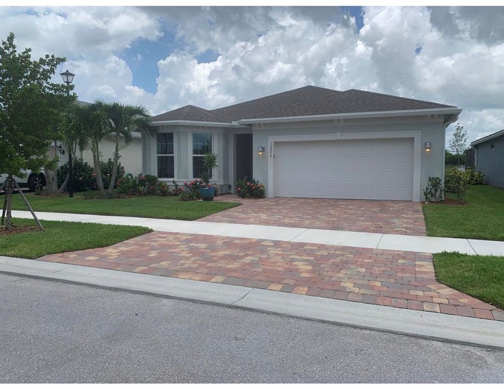Photo of 12670 SW Cattleya Lane, Port Saint Lucie, FL 34987 (MLS # R10734368)