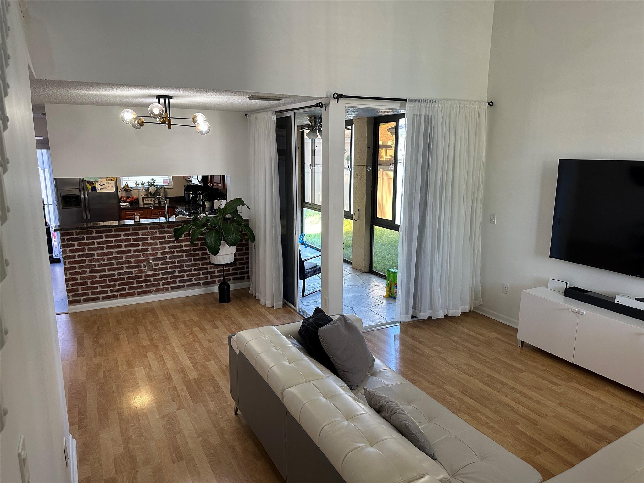 Escape to your private oasis in Pembroke Pines' desirable Pierpointe gated community! This beautifully maintained 3-bed, 2.5-bath home perfectly blends comfort and convenience. Imagine enjoying coffee on your private, decked patio or taking a dip in the community pool just a short stroll away. The spacious, open layout with wood laminate floors is ideal for entertaining, while the freshly renovated bathrooms add a touch of luxury. With recent upgrades including new appliances and a smart thermostat, this home is truly move in ready. Experience resort-style living with access to a pool with jacuzzi, and serene lake views within a short walking distance. Don't miss this piece of paradise