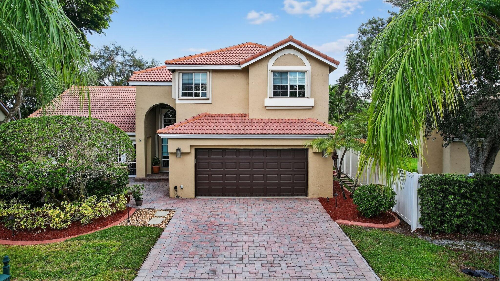 Step into serene living in Laguna Springs, one of Weston's most desirable gated communities with just 142 homes. This spacious and beautifully maintained 2-story single-family home offers 4 bedrooms, 3 full bathrooms, 2,394 square feet of living space, and tranquil double lake views situated directly across from the community pool for added convenience and resort-style enjoyment. Inside, the first floor is centered around the expansive primary suite, which features a large walk-in closet with built-ins, a spa style bathroom with a separate tub and shower, double vanity, and ample storage. One of the home's standout features is the attached Retreat, which functions perfectly as a private office, media room, nursery,