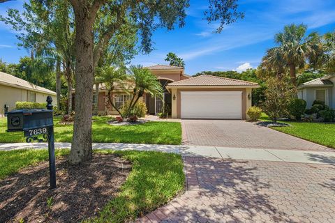 Photo of 7639 Tarpon Cove Circle, Lake Worth, FL 33467 (MLS # B26054548)