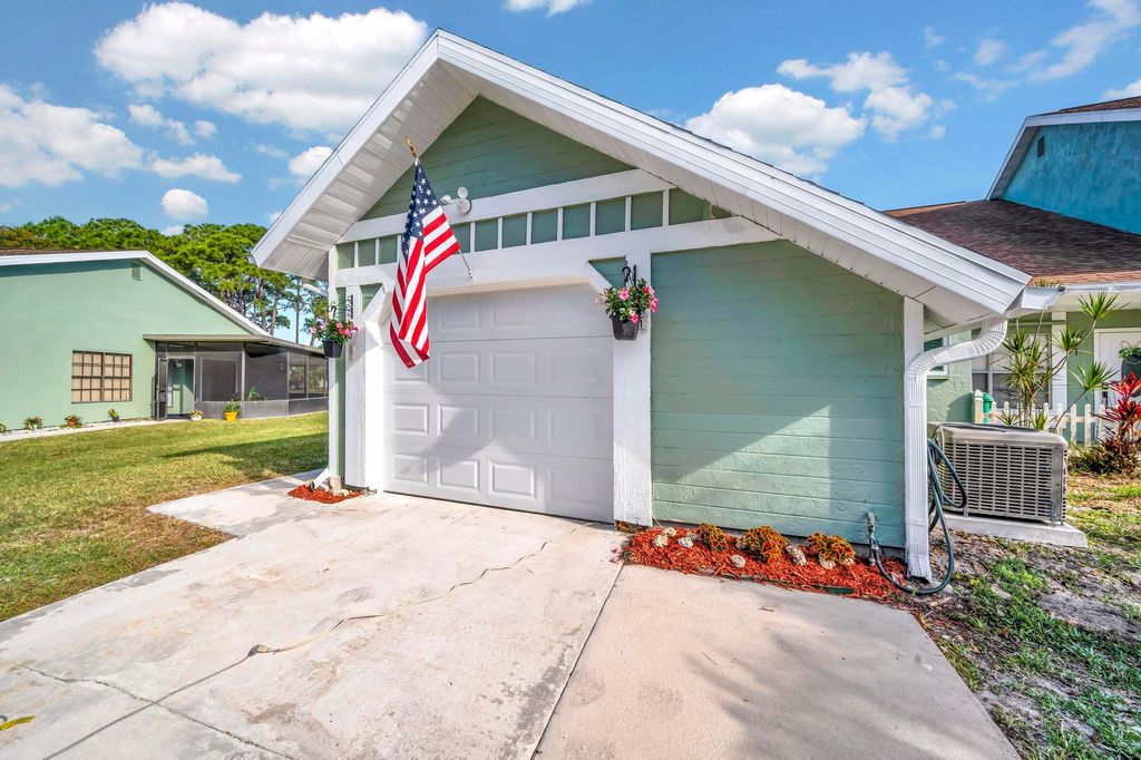 Photo of 1461 SE Rivergreen Circle, Port Saint Lucie, FL 34952 (MLS # R10974825)