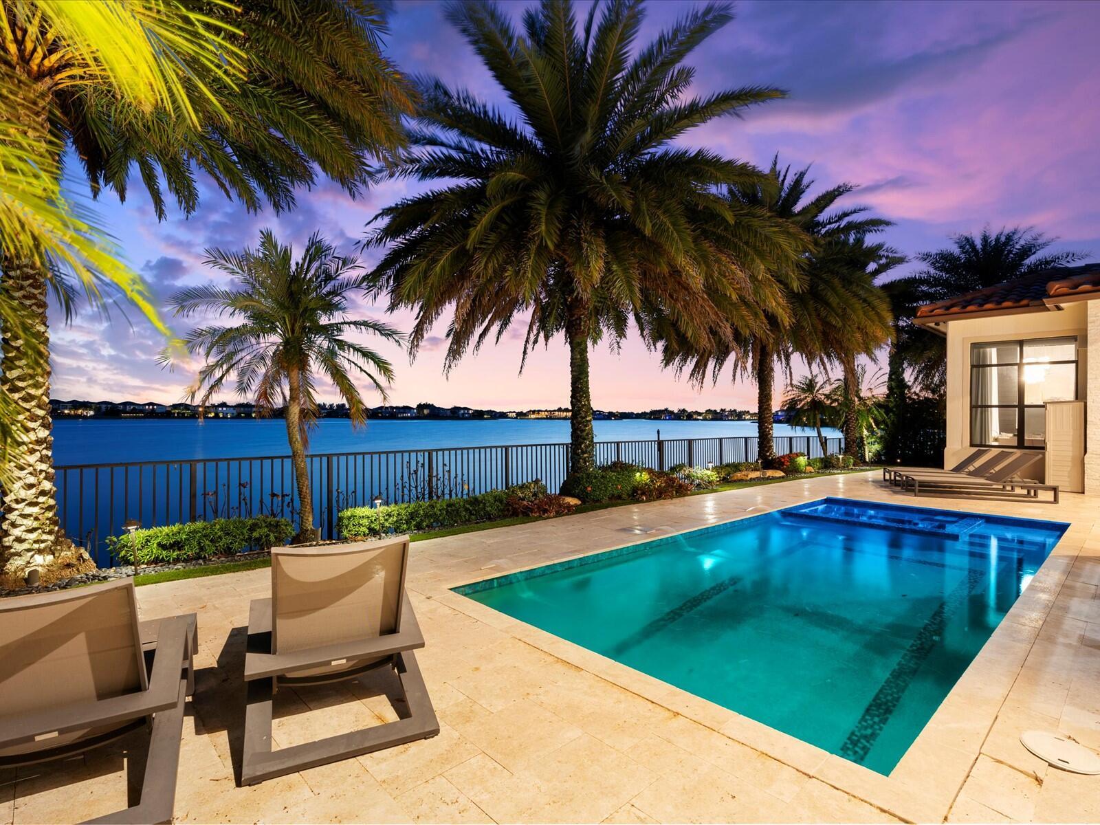 A rare opportunity to own a designer-upgraded 5-bedroom, 4.5-bath estate with breathtaking wide lake views of the 240-acre Lake Majesty, located in the prestigious gated community of MiraLago. This beautifully appointed single-story residence blends timeless elegance with modern luxury, showcasing meticulous craftsmanship and thoughtful enhancements throughout.Step inside to discover crown molding, custom electric blinds, and designer drapery. The family room and primary suite each feature elegant fireplaces that add warmth and sophistication.The heart of the home is a chef's kitchen outfitted with premium Sub-Zero & Wolf appliances and anchored by a large waterfall island, ideal for entertaining or casual dining. Throughout the home, Restoration Hardware lighting and fixtures