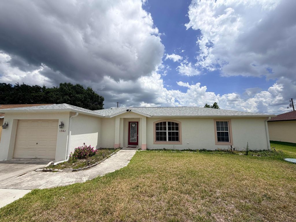 Photo of 1342 SW Wampler Avenue, Port Saint Lucie, FL 34953 (MLS # B26027250)
