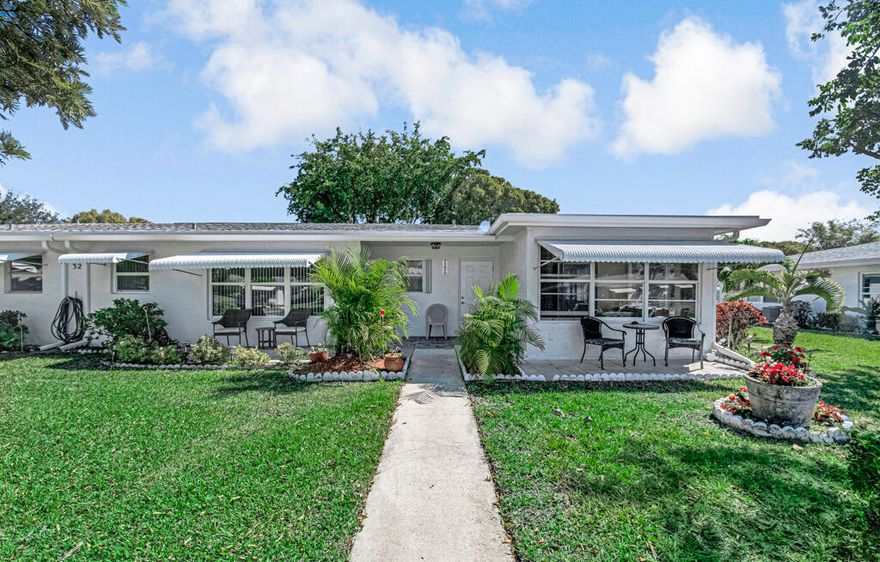 Beautifully updated  corner villa in the desirable 55+ community of Point Overlook. This spacious well maintained 2BR/2BA home includes beautiful renovated kitchen and  bathrooms plus an  additional Florida room. Cozy backyard with mature trees offers place for relaxing or entertaining. Enjoy a single-family home feel with both front and back yard space. Corner unit with hurricane windows provides  natural light. Newer roof.  Assigned parking directly in front of the unit. Community amenities include pool, sauna, fitness center, library, billiards, and clubhouse. Quiet, well-maintained community conveniently located near shopping, I-95, and area beaches