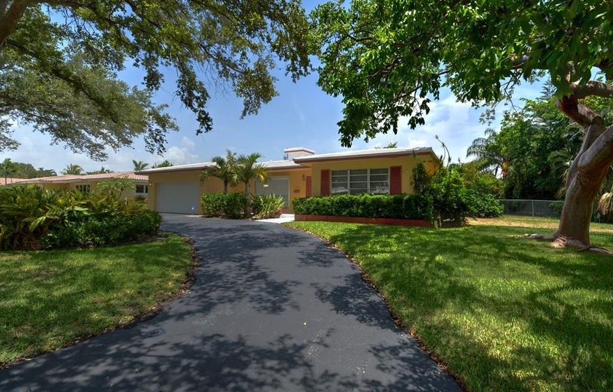 If you are looking for a wonderful family home come step inside this 3 bedroom 2 bath home in the sought after area of Lighthouse Point.  This charming pool home has updated baths & kitchen with beautiful cabinetry, new appliances and gorgeous granite counter tops.  Enjoy entertaining by the large screened in lap pool on this oversized manicured corner lot . Always a plus is a large 2 car garage and circular drive. Don't miss the opportunity to live in this beautiful home & area at the best price around!