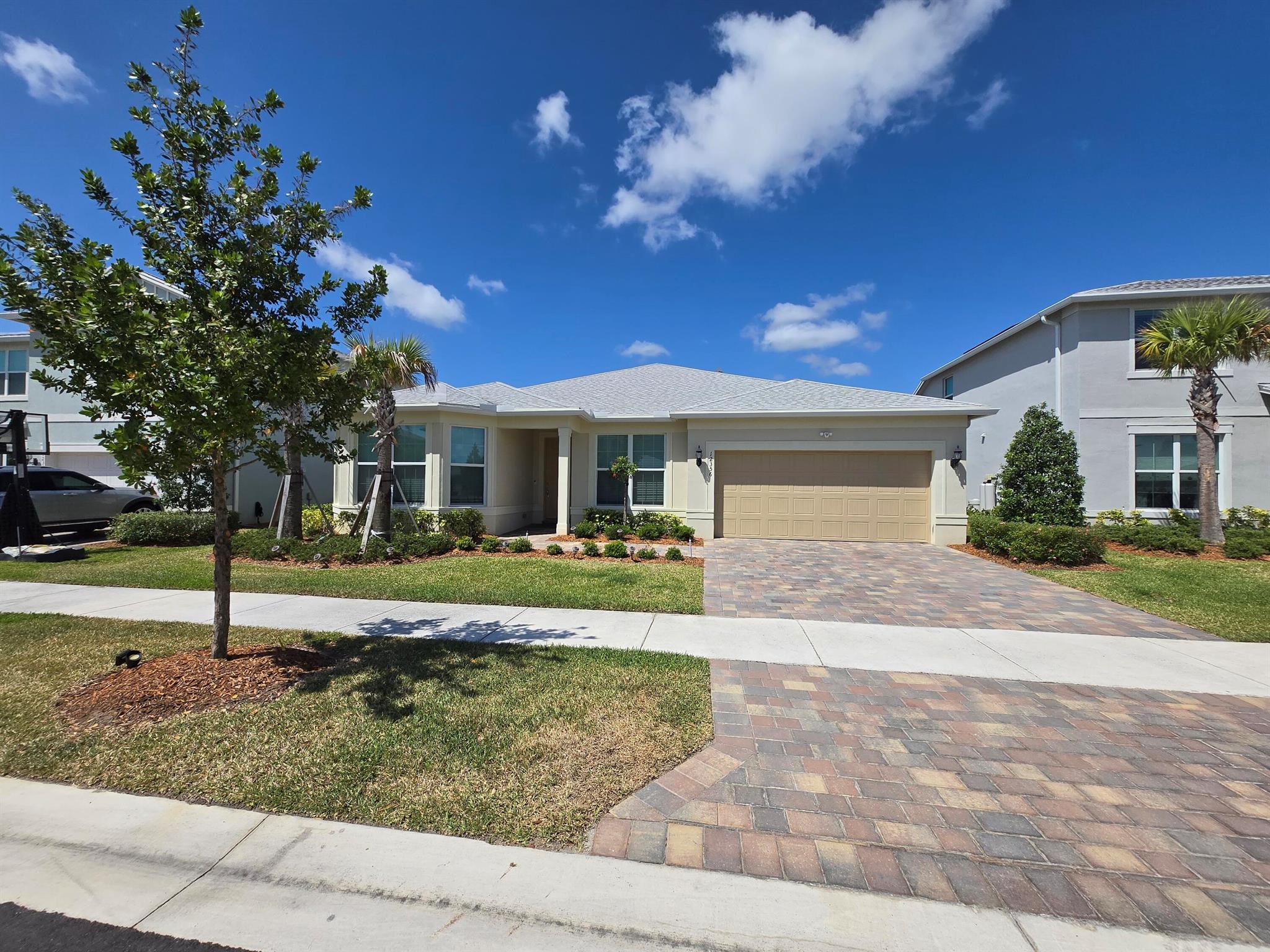 Discover your dream home, built 2023.This stunning and fully updated 5 bedrooms 4bathrooms home nestled in the desirable tradition area of Port St Lucie. Perfectly designed for comfort and modern living, this spacious residents offers an open layout stylish finishes and thoughtful upgrades throughout. Located in a security gated community with resort-style amenities, sparkling community pool and beautiful maintained common areas. Internet, home security system, and lawn maintenance are all included for worry free living. Additional features: Modern Kitchen stainless steel appliances, generous master suite with en suite bathroom, ample storage and closet space. Attached double car garage. Enjoy tranquil views as the property backs onto peaceful lake, ideal for relaxing evenings or