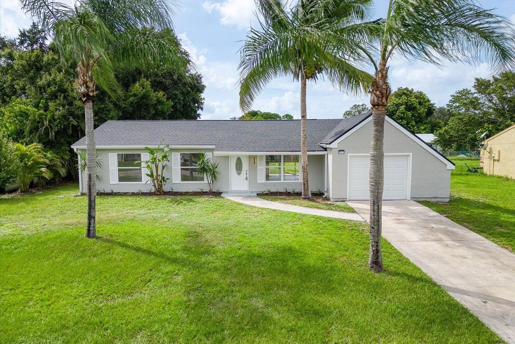 Photo of 317 SW Kentwood Road, Port Saint Lucie, FL 34953 (MLS # R11028862)