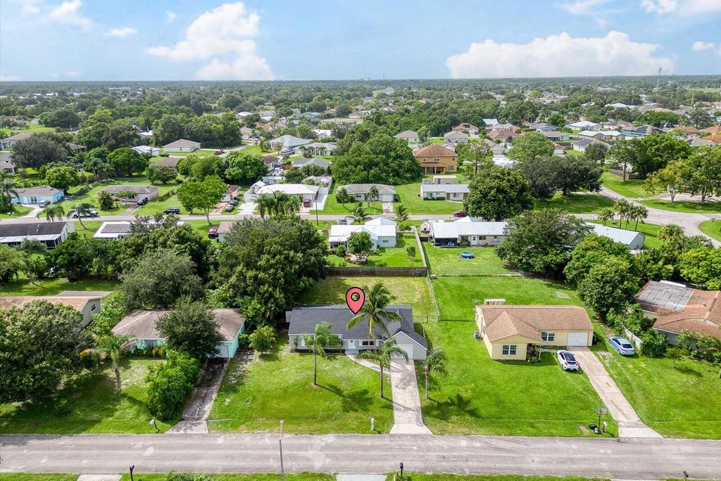 Photo of 317 SW Kentwood Road, Port Saint Lucie, FL 34953 (MLS # R11028862)