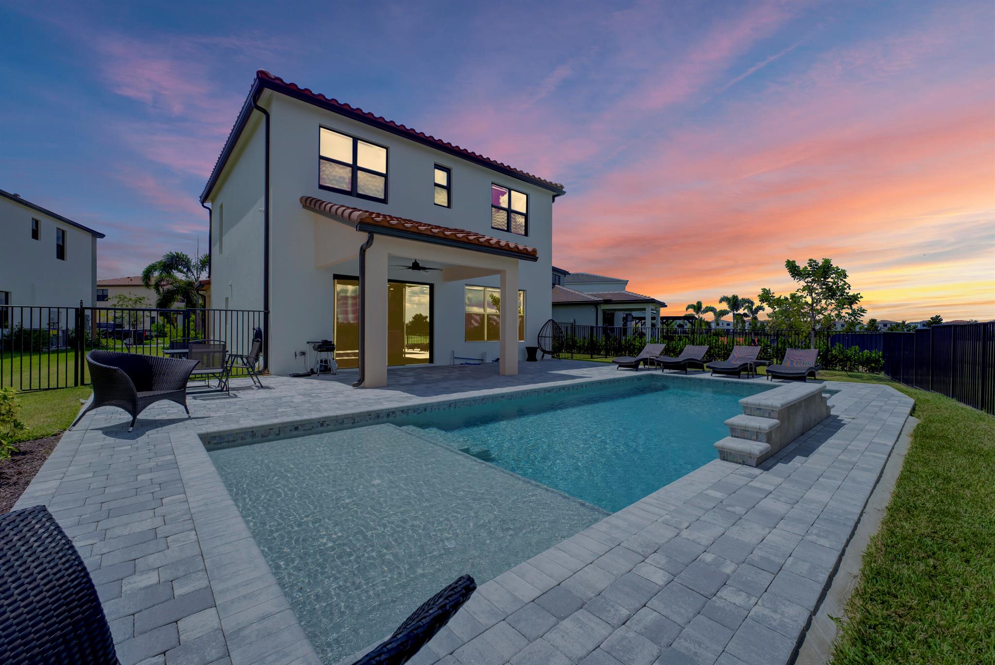 Ready for immediate move in. Experience the epitome of luxury living in this meticulously upgraded home where the owner left no stone unturned in selecting premium enhancements from the builder. This stunning residence boasts 4 spacious bedrooms, 3.5 exquisite baths, and an expansive loft. The kitchen is a chef's dream, gas stove fitted with 42-inch cabinets, accented by museum-grade upper cabinets. An extended cabinetry feature provides ample space for a snack or buffet bar, perfect for entertaining. Delight in the beauty of laminate flooring that graces the entire upstairs, coupled with hurricane-impact windows ensuring safety and tranquility.