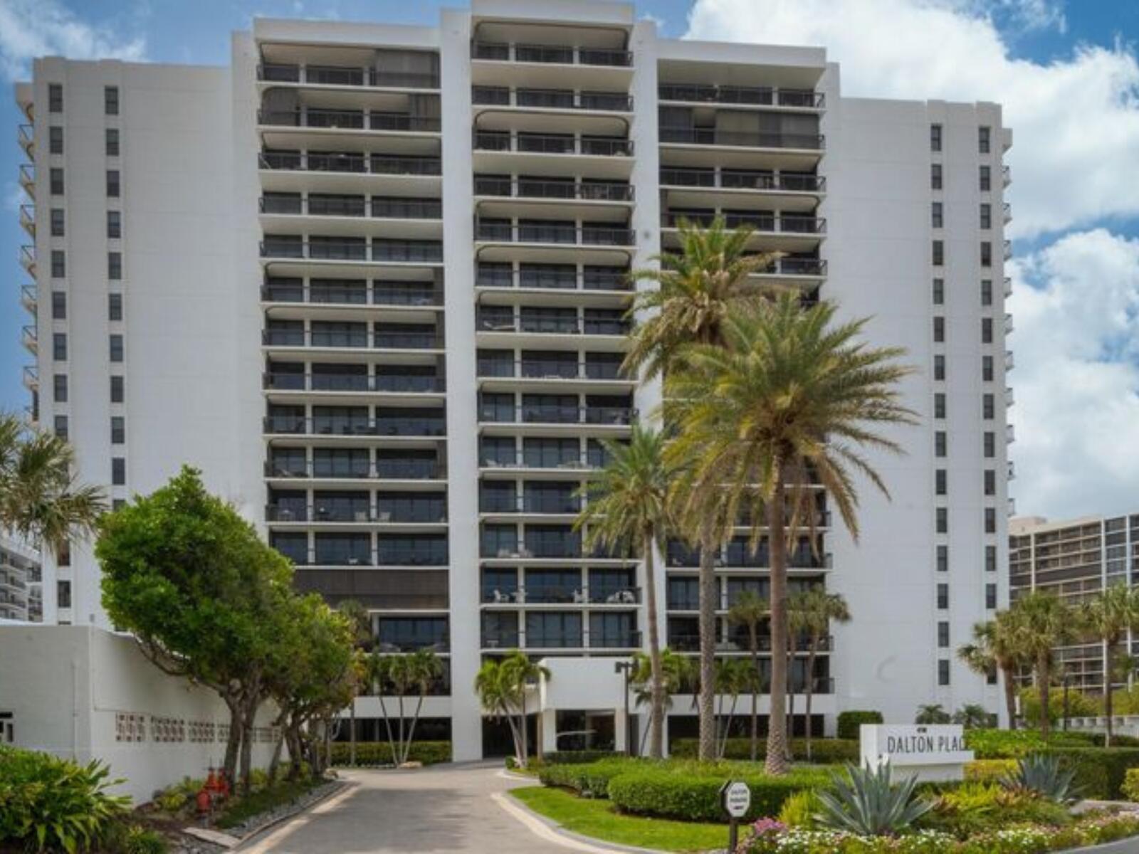 Turnkey 3-Bedroom Corner Residence with Panoramic ViewsPerched on the 5th floor of the prestigious Dalton Place in Highland Beach, Florida, this fully furnished 3-bedroom, 3-bathroom corner unit offers an exceptional coastal living experience. The split floor plan showcases stunning ocean views, complemented by a spacious balcony perfect for entertaining or relaxing.The upgraded kitchen features granite countertops and modern appliances, including a cooktop, dishwasher, microwave, two refrigerators, and an in-unit washer and dryer conveniently located in the hallway closet. Designer tile and elegant crown moldings flow throughout, while the living and dining areas boast a tasteful combination of ceramic tile and decorative carpeting. Impact glass windows and sliding doors open to th