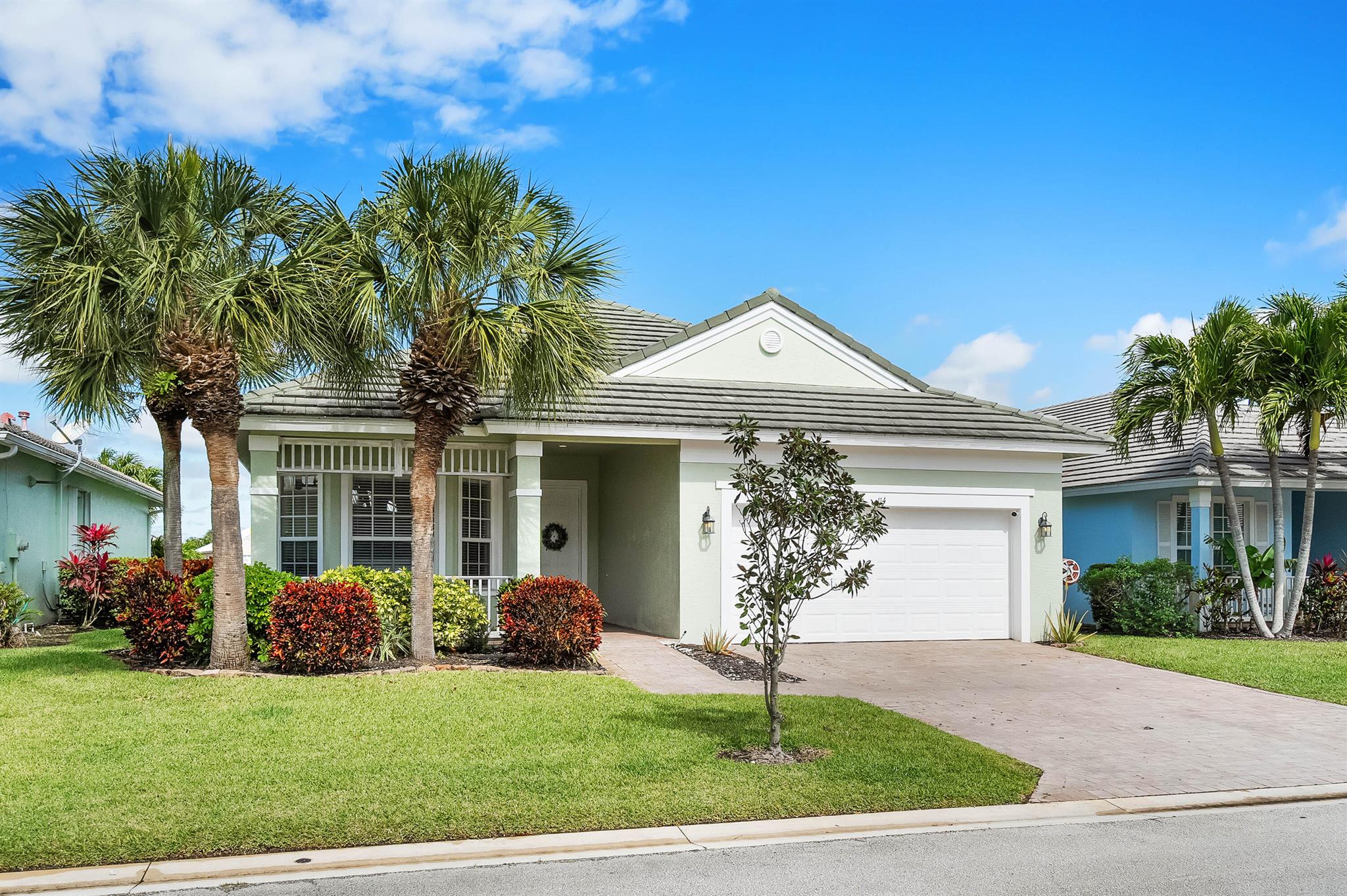 Follow tree lined streets to this striking 4-bedroom, 3-bathroom premium lake-view retreat in the sought-after, gated community of Magnolia Lakes! Featuring a thoughtfully designed three-way split floor plan, this home offers both privacy and functionality. Soaring vaulted ceilings create an airy, open feel, while luxury vinyl plank flooring is both beautiful and durable. The updated kitchen has Calcutta quartz countertops and a spacious bar top, perfect for entertaining. Cozy up by the LED-lit quartzite stone-wrapped fireplace, a true showpiece of the living space. With breathtaking lake views from your screened patio and fully fenced back yard, this home is a must-see. Fabulous amenities include a tot lot, basketball court, pool, tennis court, clubhouse, gym and steam room. Tucked away