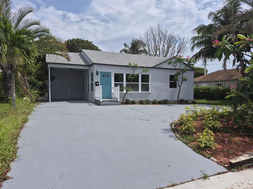 Newly renovated house, large living and Family room, hurricane impact windows, new roof, new kitchen and baths