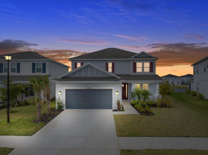 Welcome to 11654 SW Macelli Way, a Taylor Morrison Bahama model still under builder warranty, offering peace of mind and modern construction in the desirable Central Park community of Port St. Lucie. This spacious home features impact windows, a bright open floor plan with a dramatic two-story great room, and a stylish kitchen with a large island and walk-in pantry. The first-floor primary suite provides comfort and privacy, while the upstairs loft and additional bedrooms offer flexible living space. Enjoy serene lake views, relax on the charming front porch, and take advantage of Florida living on the covered lanai, all conveniently located near shopping, dining, and major commuter routes.