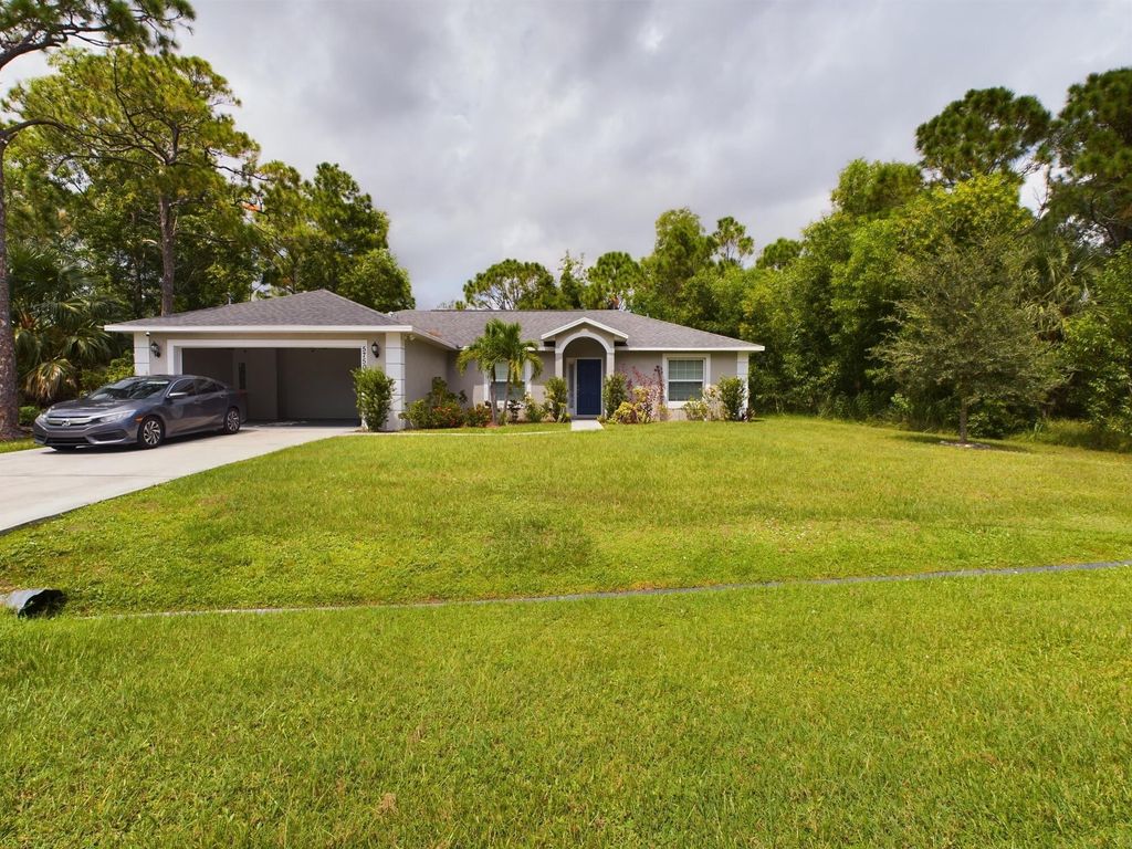 Photo of 5750 NW Zenith Drive, Port St Lucie, FL 34986 (MLS # R10918879)