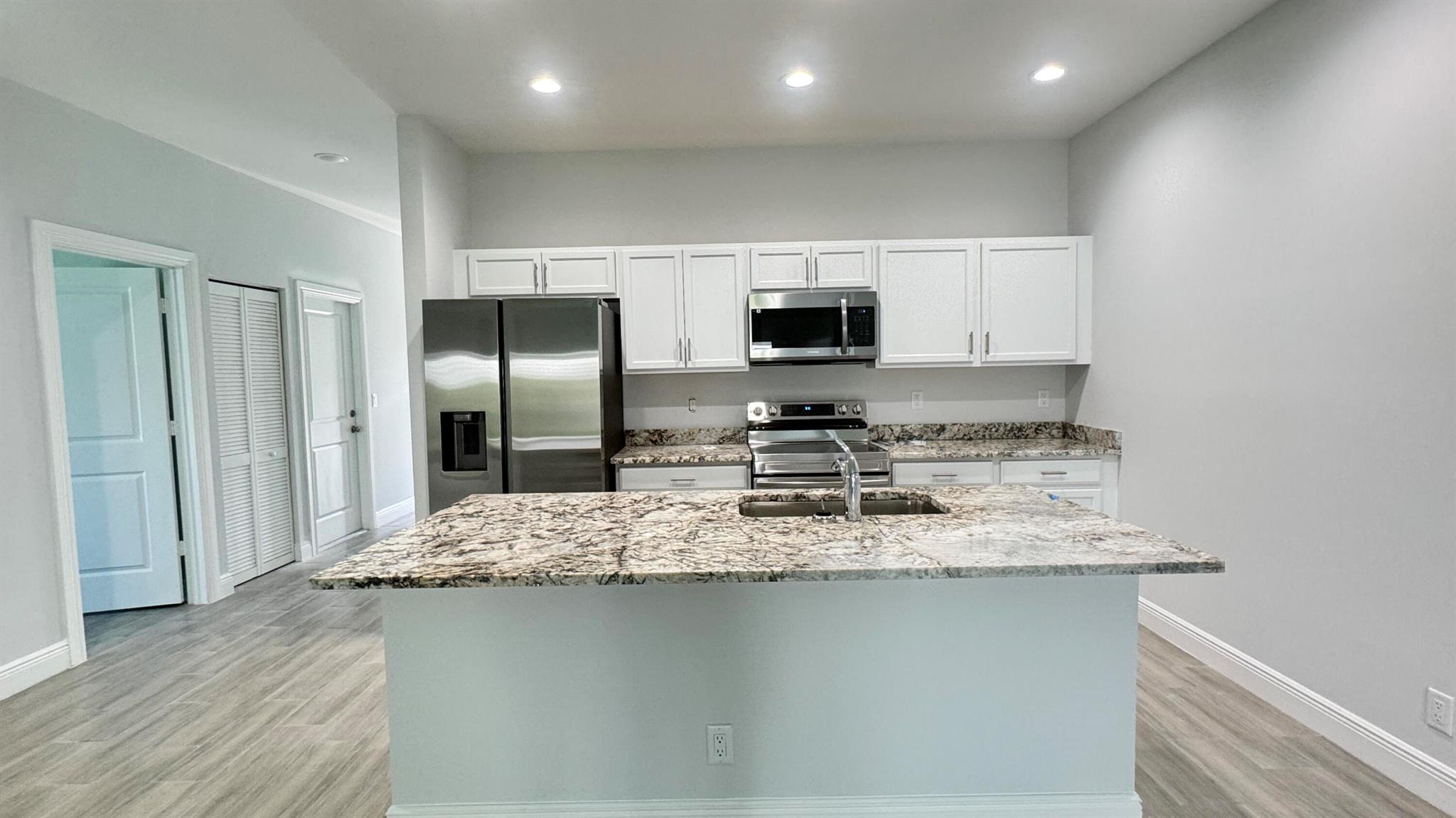 SHAZAAM!!! NEW CONSTRUCTION FOR UNDER $300,000 with concrete block construction, 3 bedrooms, 2 baths, all tile flooring, granite kitchen counter tops, and IMPACT WINDOWS. All in a country setting near interstate, Indian River Mall, restaurants, shopping, ocean, and more.