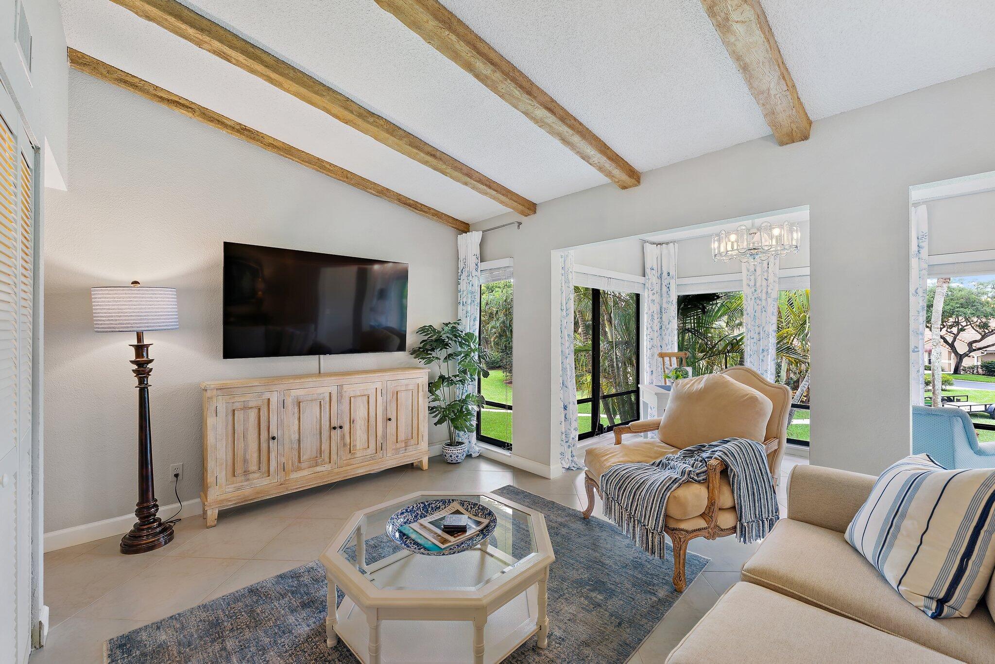 Immaculate, renovated, turn key 2BR/2BA on 2nd floor with vaulted, wood beam ceilings makes this a beautiful, open concept design in PGA National. This condo has just been transformed with brand new paint, modern lighting and fans, fresh white blinds, contemporary drapery, elegant vanities in both baths, brand new Toto toilets, newer kitchen with stainless steel appliances, plenty of storage, new water heater PLUS comes fully furnished including linens, kitchenware and 3 smart TV's. See document for details. Amazing investment property! PGA Nat'l Resort and Spa has just completed a multi-million dollar renovation. Great, central location near top-notch shopping, restaurants, pristine beaches and close to the airport, I-95/Turnpike.