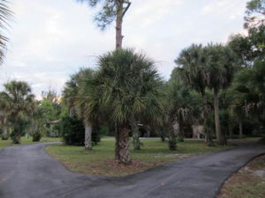 WOW!+/- 2.46 ACRES OF LAND! HOME ON PROPERTY WITH LARGE FRONT PORCH AND A TWO CAR, CARPORT. SO MANY POSSIBILITIES WITH THIS PROPERTY!  ABSOLUTE MUST SEE.