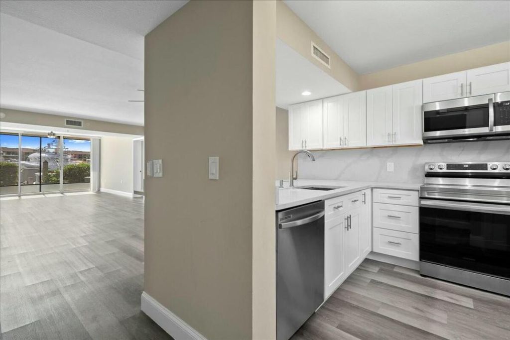 Photo of 2601 Marina Isle Way #103, Jupiter, FL 33477 (MLS # R11081935)