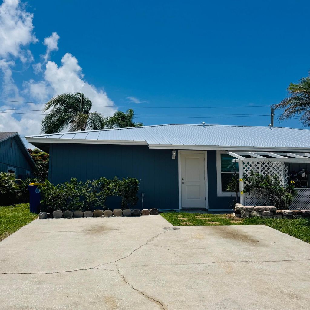 Photo of 4421 SE Village Road, Stuart, FL 34997 (MLS # B26032400)