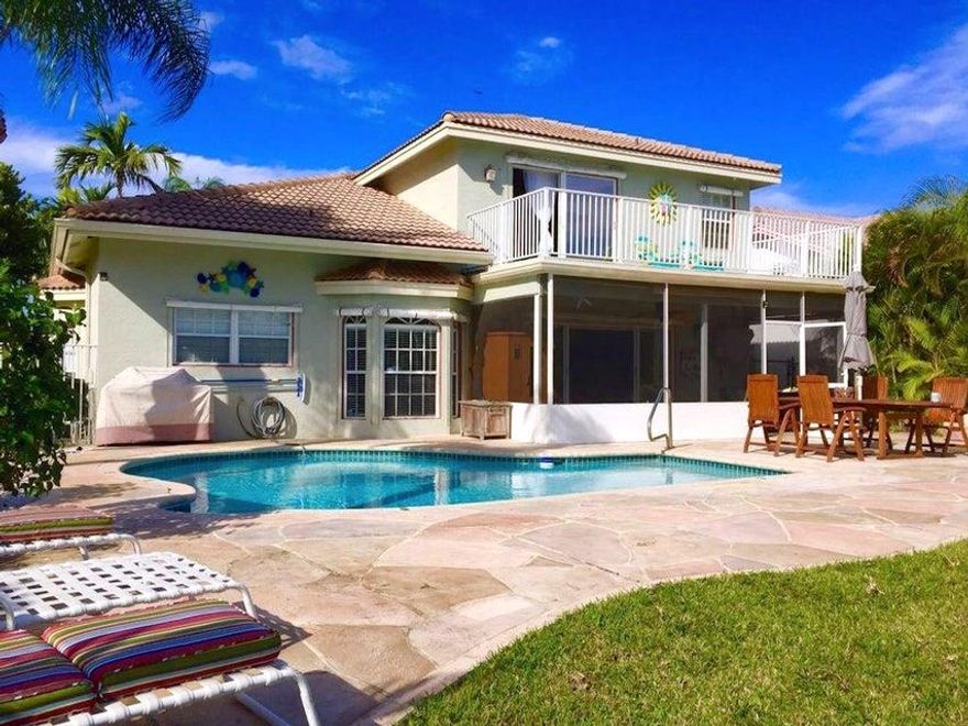 WOW! $20,000 In Recent Upgrades! WaterFront! This magnificent home lies in this fabulous Private Gated Boutique Community so centrally located to all your daily needs. 
4 bedroom, 3 full bath, waterfront pool home with upgrades galore. Mature landscaping abounds fenced in yard area.
Stone Patio Deck surrounds freeform heated pool and grill area.
Peaceful water view with abundant fish.
Sophisticated interior architectural features, crown molding throughout. Stainless Steel kItchen with tons of cabinets and pantry. Covered Screen Room leads to pool deck. Glorious natural light abounds throughout. Master bedroom with 2 custom ''built in'' closets and 20ft balcony. Bath boasts Garden Tub with two windows, Glass Shower Dual Vanities. Much More! There are two additional bedrooms on the second floor each with built-in closets, ceiling fans and hardwood floors. There is an additional full bath for these bedrooms.  Downstairs has a guest suite with private full bath. Den had built-in entertainment center. Low Cost LED lighting installed in living room and Kitchen, Newly Remodeled Laundry Room, Oversized 2 car garage with built in storage for Phantom hurricane shutters and Central Vac. Meticulously maintained by owner. Hurry before this one gets taken away!