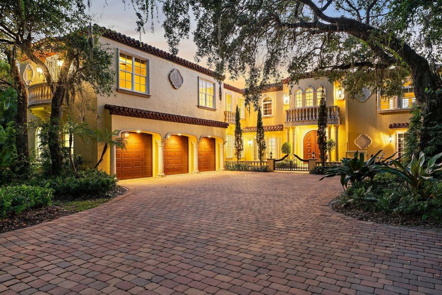 Spectacular Riverfront Property with Deep Water Access for Large Vessels! Minutes from the St Lucie Inlet, this Mediterranean-inspired estate offers premier dockage with dual slips, boat lift, wide-water views, and a newly re-planked dock with covered pavilion. Through private gates, be transported to Tuscany as cypress and mature oaks frame Villa Loggia, blending Old World elegance with modern comfort. Inside, enjoy a grand open kitchen and family room with walls of windows, a richly appointed mahogany office, and a temperature-controlled wine room. Upstairs, retreat to a expansive primary suite with dressing room, while ensuite guest rooms enjoy a private living area. An elevator adds convenience.