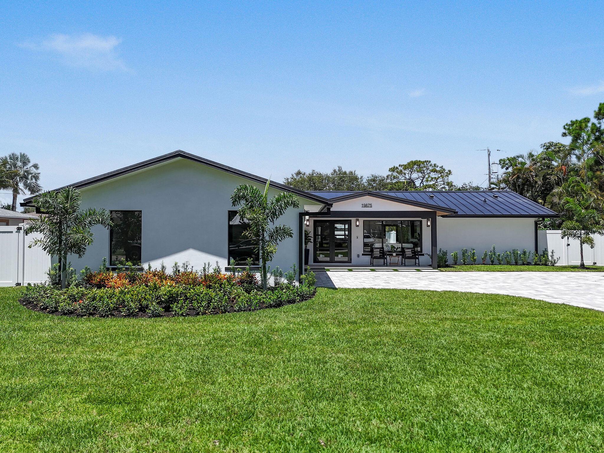 Complete and totally renovated 3/2 single family home in the desirable Jupiter/Tequesta area. Everything brand new including metal roof, PGT impact windows & doors, all electrical & plumbing, wood flooring, quartz countertops & backsplash, ss appliances, fully fenced backyard, lush landscaping, pavered drive. Designer decor and finishes throughout. No HOA, no rental restrictions, no storage restrictions for boats/RVs and zoned for A rated Jupiter schools. Located very close to public boat ramps, Jupiter lighthouse, beautiful Jupiter beaches, and local restaurants.