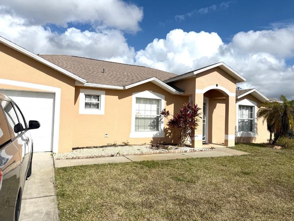 Photo of 1013 SW London Lane, Port Saint Lucie, FL 34953 (MLS # R11151490)