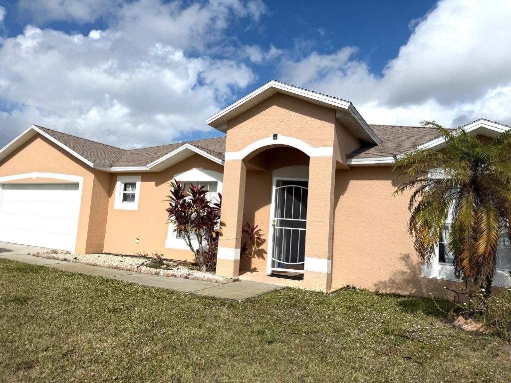 Photo of 1013 SW London Lane, Port Saint Lucie, FL 34953 (MLS # R11151490)