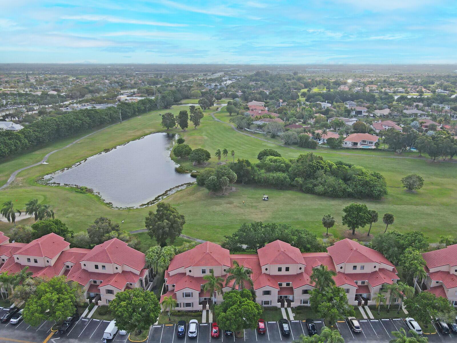 Paradise in Pembroke Pines at the lowest price in GRAND PALMS! Scenic lake and golf course views from this upgraded & improved ground-floor residence in a gated community! Heavenly vibes overlooking the GRAND PALMS GOLF PUBLIC COURSE. No membership required (very affordable) just pay & play! The kitchen (with stainless steel appliances and tile backsplash) and baths have been improved, and the floors are all ceramic tiles. The covered and screened patio is the perfect spot to enjoy the sunrises with a beautiful lake and gold course greenspace. New roof, newly painted and modern color buildings make you proud to call it home. Likely the best ownership (already appraised) opportunity and value in Las Verdes and Grand Palms! See it and own it! NO PENDING ASSESSMENTS GUARANTEED THIS YEAR!