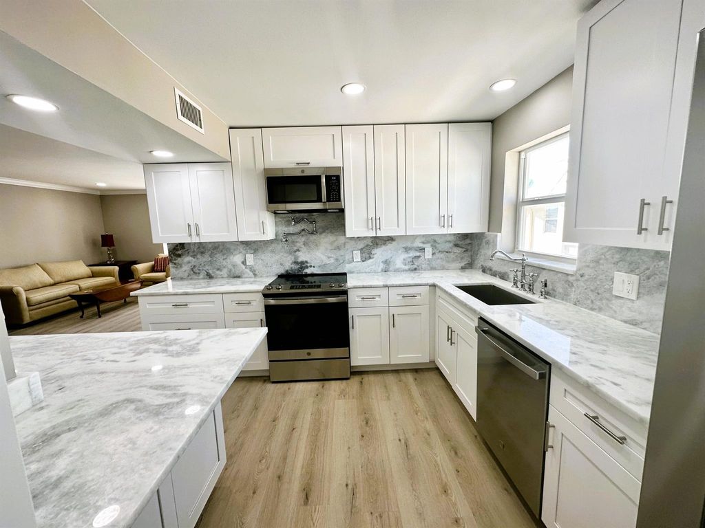 Photo of 7 Colonial Club Drive #304, Boynton Beach, FL 33435 (MLS # R11107217)