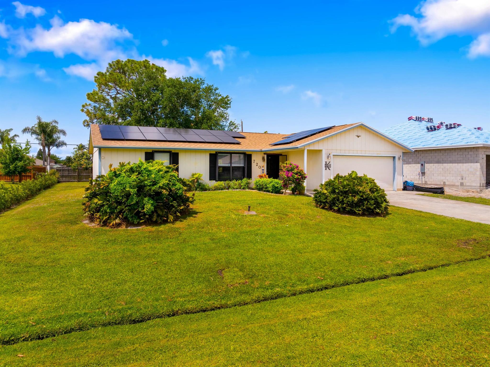 Welcome to this beautifully updated home nestled in the heart of Port St. Lucie! Featuring 3 spacious bedrooms and 2 full bathrooms, this move-in ready gem offers comfort, style, and energy efficiency. Enjoy peace of mind with a newer roof (2022) and brand-new A/C (2024), plus the added benefit of solar panels for reduced energy costs. The light-filled Florida room offers the perfect space to relax or entertain, with access to the backyard. Inside, you'll find updated finishes, an open-concept living area, and a functional kitchen ideal for both cooking and gathering. Located in a quiet, central neighborhood with easy access to shopping, schools, and parks--this home has it all!