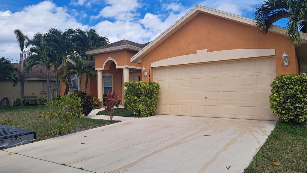 Photo of 3631 SW Kasin Street, Port Saint Lucie, FL 34953 (MLS # R10991205)