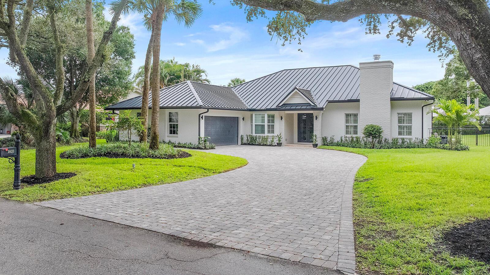 Located in the famously breathtaking oak tree lined riverside community Heritage Oaks in Tequesta, Fl. sits this completely remodeled 3,053 sq. ft. 4 bedroom/4.5 bath CBS construction pool home. New 2025 metal roof. All new bathrooms and closets. New kitchen, kitchen appliances, AC's, hot water heater. Every inch of the home has been touched and updated. Beautiful large fenced in back yard with refinished pool and spa. Ideal location just minutes from the beach and all of the amazing dining and shopping that Jupiter has to offer.