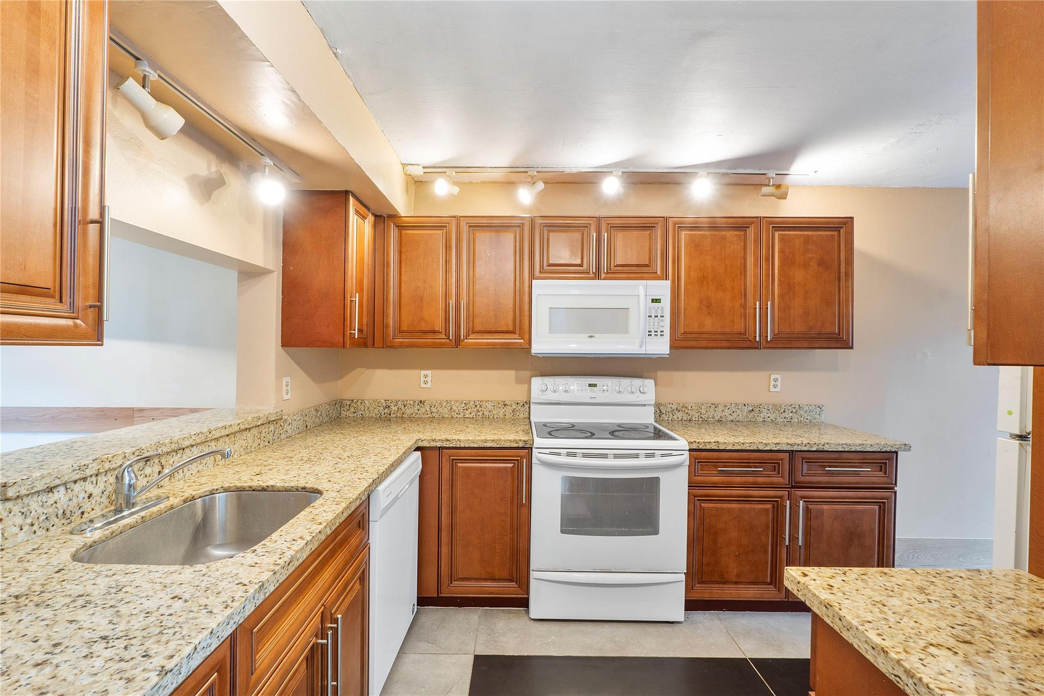 MOTIVATED SELLER! INVESTORS CAN RENT RIGHT AWAY! HOA INCLUDES INSURANCE AND ALL EXTERIOR REPAIRS. FHA, VA FRIENDLY NO MINIMUM DOWN PAYMENT REQUIRED. ROOF 2 YEARS OLD! IMPACT WINDOWS AND DOORS. NEW WOOD FLOORING UPSTAIRS, NEW INTERIOR PAINT & NEW OVEN!3 Bedroom 2.5-bathroom townhome in family friendly Centura Parc. The updated kitchen features granite countertops & real wood cabinets. Tile throughout the first floor & new wood flooring upstairs. Large primary bedroom features walk-in closet. Screened front patio & fenced rear patio perfect for grill and outdoor furniture. The gated community features an Olympic-sized pool, tennis & basketball courts, RV & boat storage, game rooms, 24/7 security & even a private school onsite. Great community for families with all kinds of activities