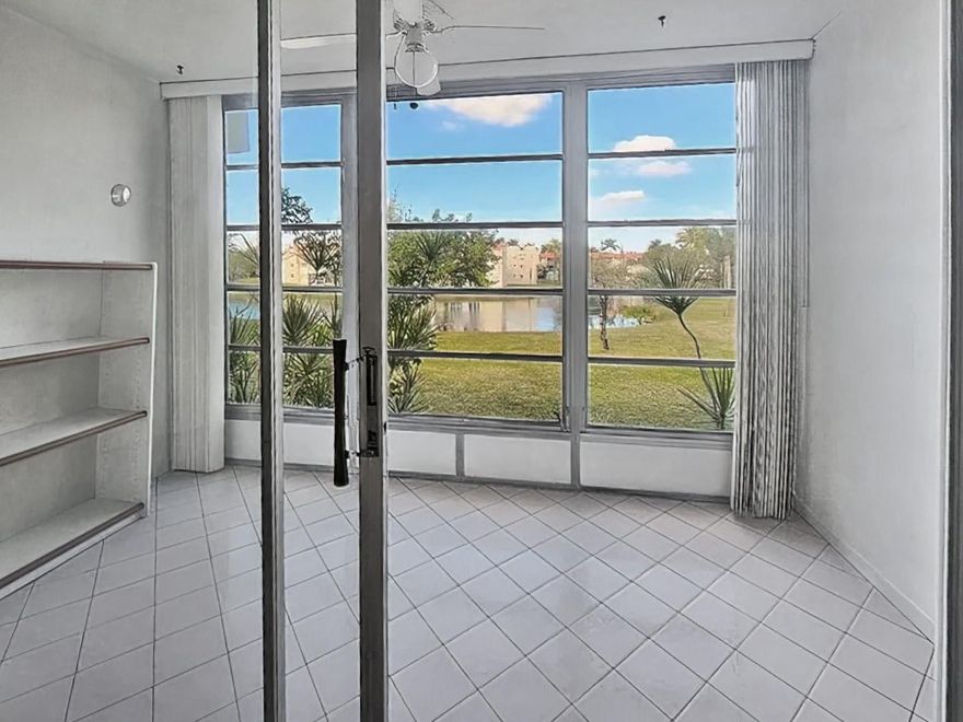 Bright and spacious 2-bedroom, 2-bathroom condo in the desirable 55+ Sunrise Lakes community, offering peaceful lake views. Freshly painted and well-maintained, the unit features a functional layout, generous living areas, and large closets. Elevator access. Amenities include heated pools, a tiki hut, fitness center, pickleball courts, and organized community events. This move-in-ready condo is ideal for buyers seeking a well-managed community.