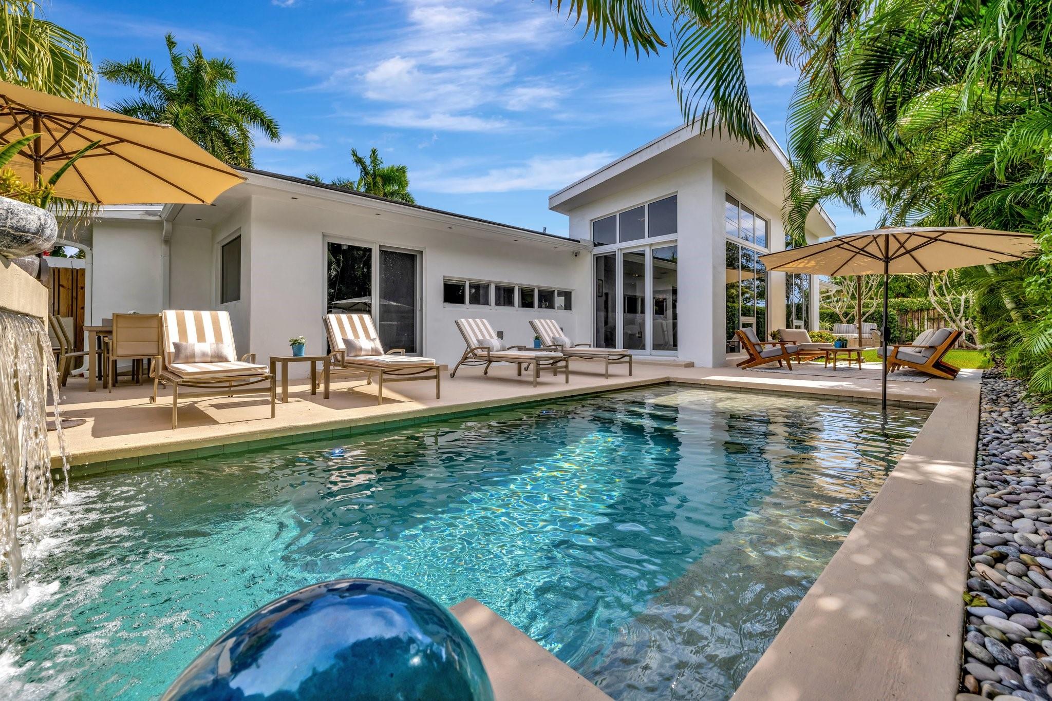 Seeking extraordinary & unique? Enjoy Californian inspired architecture & great curb appeal, award winning design throughout. Move-in ready residence, carefully curated custom finishes & materials usually found in $3m plus homes! Set-back from street with circular driveway. New roof, totally private courtyard pool area, Sonos & professional landscape lighting. Large format custom windows in living areas. Innovative floorplan, porcelain floors, modern eat-in kitchen, custom Italian cabinetry, Google smart home. Inviting living & dining areas for great entertaining flow. Expansive Primary Suite, spa quality custom bath Laufen fixtures & walk-in closet. Totally separate guest & additional bedroom, both upgraded baths (includes cabana) & Italian mosaic walls. Large 2 car garage & roof terrace