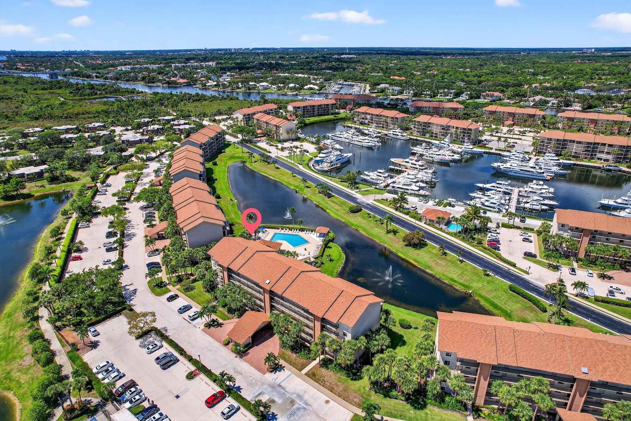Lovely corner unit 2/2 condo in the Marina at the Bluffs. Pleasant pool, lake and Marina views with screened in balcony with rolldown sun screens & ceiling fans. All windows and doors are impact windows(2021). AC 2020, water heater 2024. new washer dryer 2023. Whole home water filter Roof replaced in 2021, elevators refurbished 2024. Expanded Kitchen with stainless steel appliances & quarts countertops & baths renovated within the last 5 yrs. All assessments paid in full , all milestone work completed.