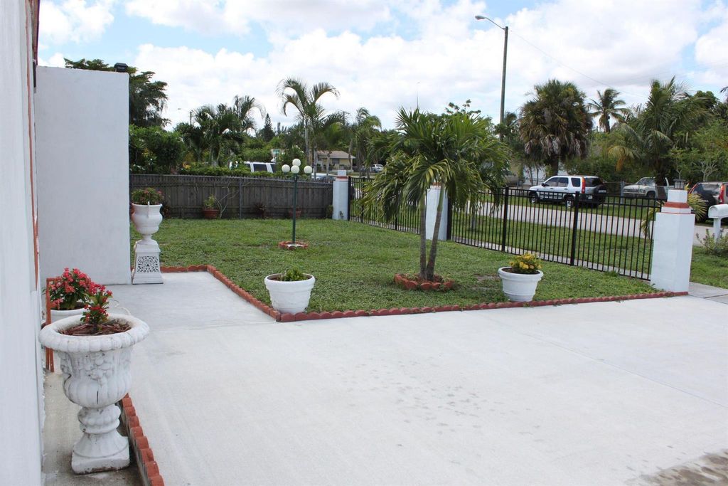 Photo of 5764 Gramercy Drive, West Palm Beach, FL 33407 (MLS # R10976434)