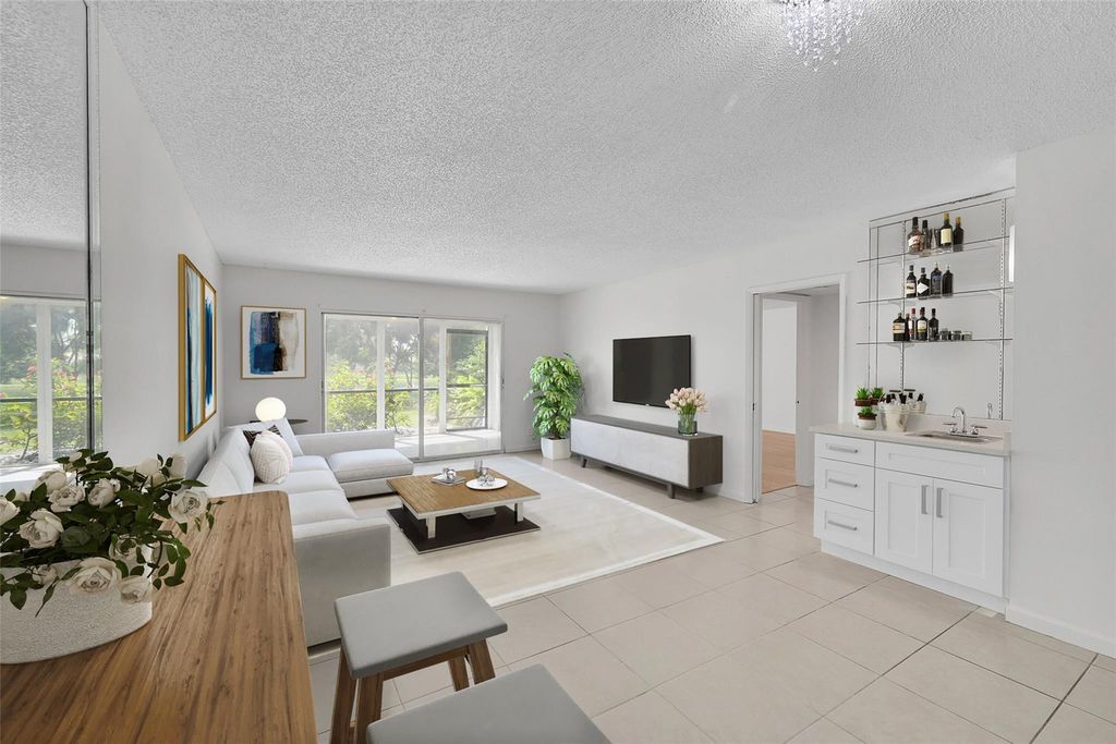 Photo of 2202 S Cypress Bend Drive #104, Pompano Beach, FL 33069 (MLS # F10493696)