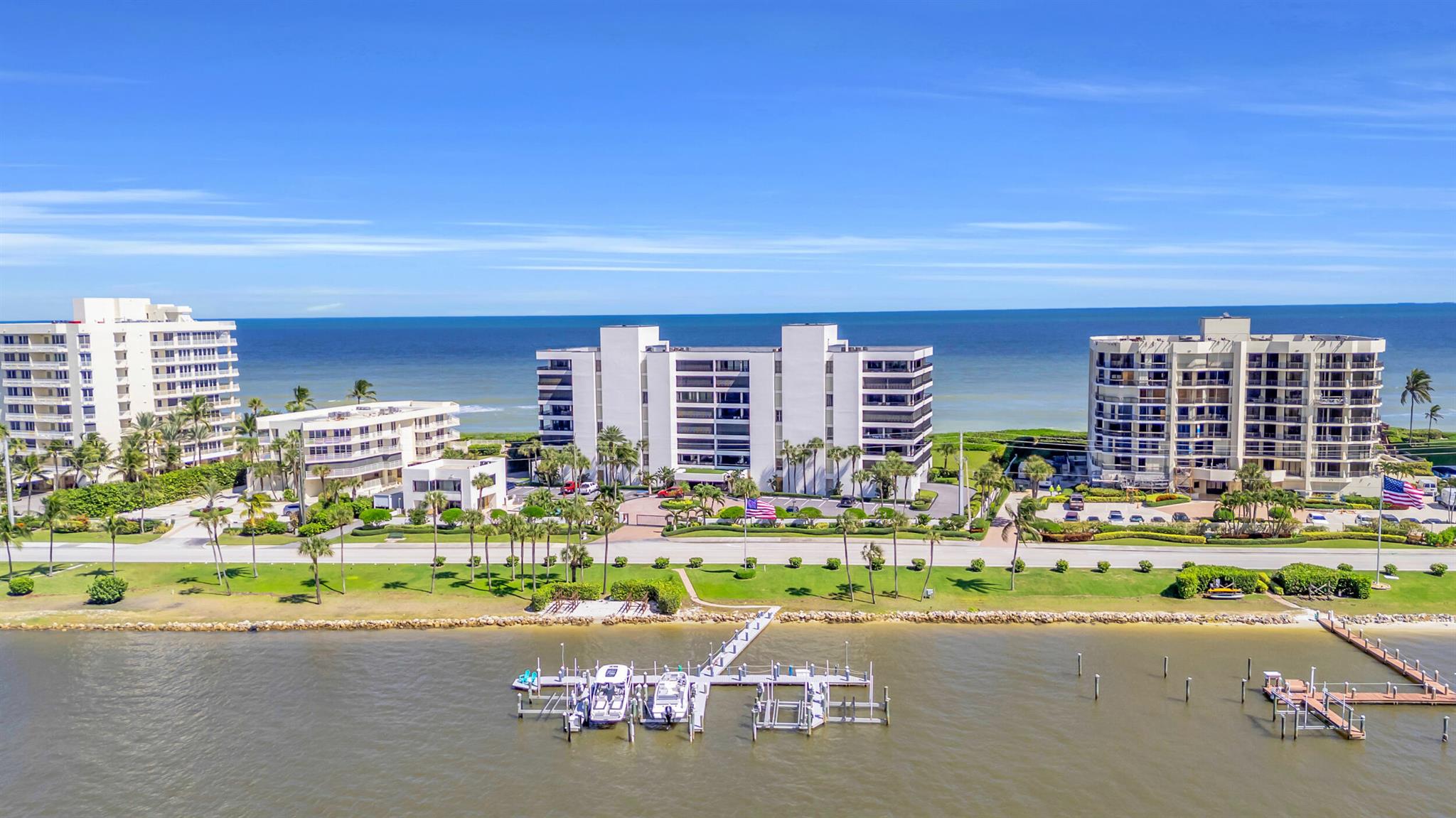 With the Atlantic Ocean to the east and the Intracoastal Waterway to the west, your most difficult decision of the day in this condo is whether to cruise on the boat or stroll the beach! A three bedroom, three bath unit with over 2,500 square feet of living space, an expansive east facing balcony to admire the sunrise and intimate west facing balcony to savor the stunning sunsets. Impact windows and shutters provide peace of mind and no need to bring patio furnishings in the unit when closing up. Gated access, assigned garage parking and storage is a perk not common to the area. Recent concrete work has been completed and assessment has been paid in full! The property boasts a pool/jacuzzi, clubhouse and fitness center. Move right in and start enjoying the Jupiter Island lifestyle.