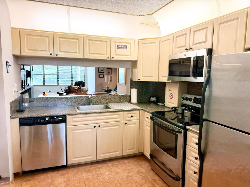 Photo of 2908 S Carambola Cir Circle S #103, Coconut Creek, FL 33066 (MLS # B26031226)
