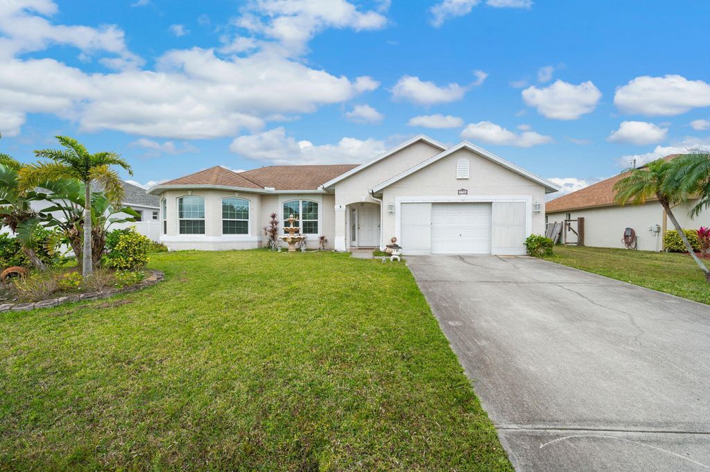Photo of 1718 SW Columbia Street, Port Saint Lucie, FL 34987 (MLS # R11155417)