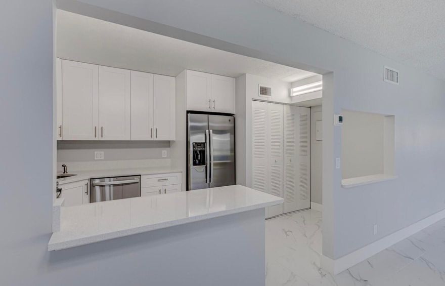 Stunning completely remodeled 2/2 in the heart of West Palm Beach ready now! Truly elegant with porcelain marble-like floors throughout! Sparkle Quartz countertops and white Shaker cabinets. Open concept with large living/dining area. Brand new Stainless Steel Appliances and W/D in unit! Nice sized bedrooms with spacious closets! One bath features a tub, the other Frameless Shower. Enjoy sitting in the bonus area looking over the courtyard! Community features a gated entrance, pool, tennis courts and playground. Minutes from the outlets, PBIA and all the other amenities Palm Beach has to offer! 660 min credit score, quick HOA approval. Seller Financing an option.  Motivated Seller. Bring all offers.