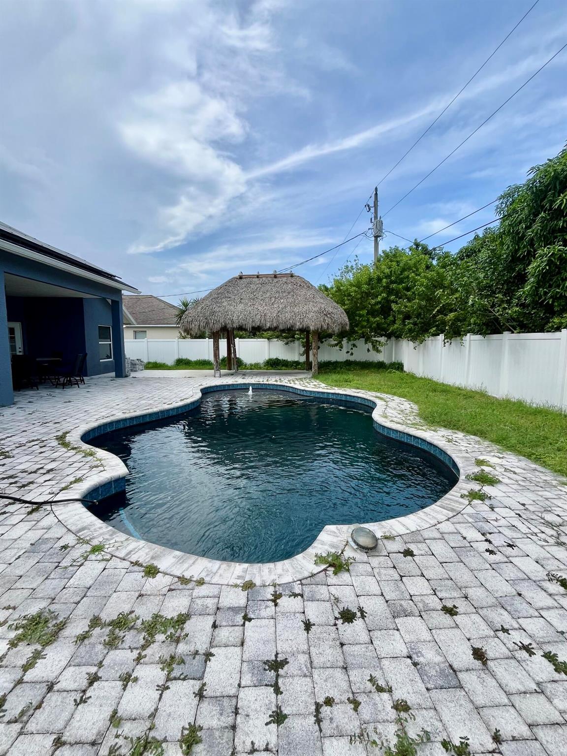 3/2 plus office home with pool and tiki hut! Upgrades throughout with stunning butcher block kitchen counters. Privacy fence backyard.