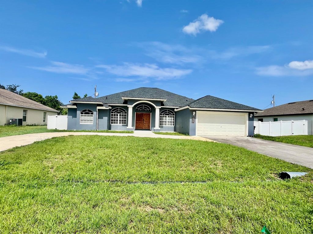 Photo of 3849 SW Mckim Street, Port Saint Lucie, FL 34953 (MLS # R11103780)