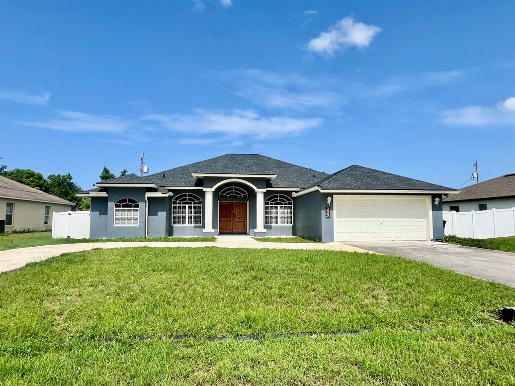 Photo of 3849 SW Mckim Street, Port Saint Lucie, FL 34953 (MLS # R11103780)