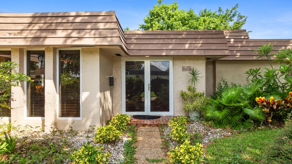 Photo of 6207 JACARANDA Circle, Tamarac, FL 33319 (MLS # B26060527)