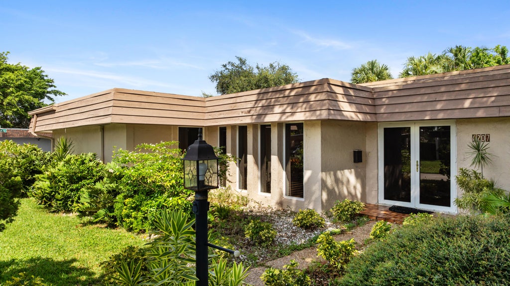 Photo of 6207 JACARANDA Circle, Tamarac, FL 33319 (MLS # B26060527)